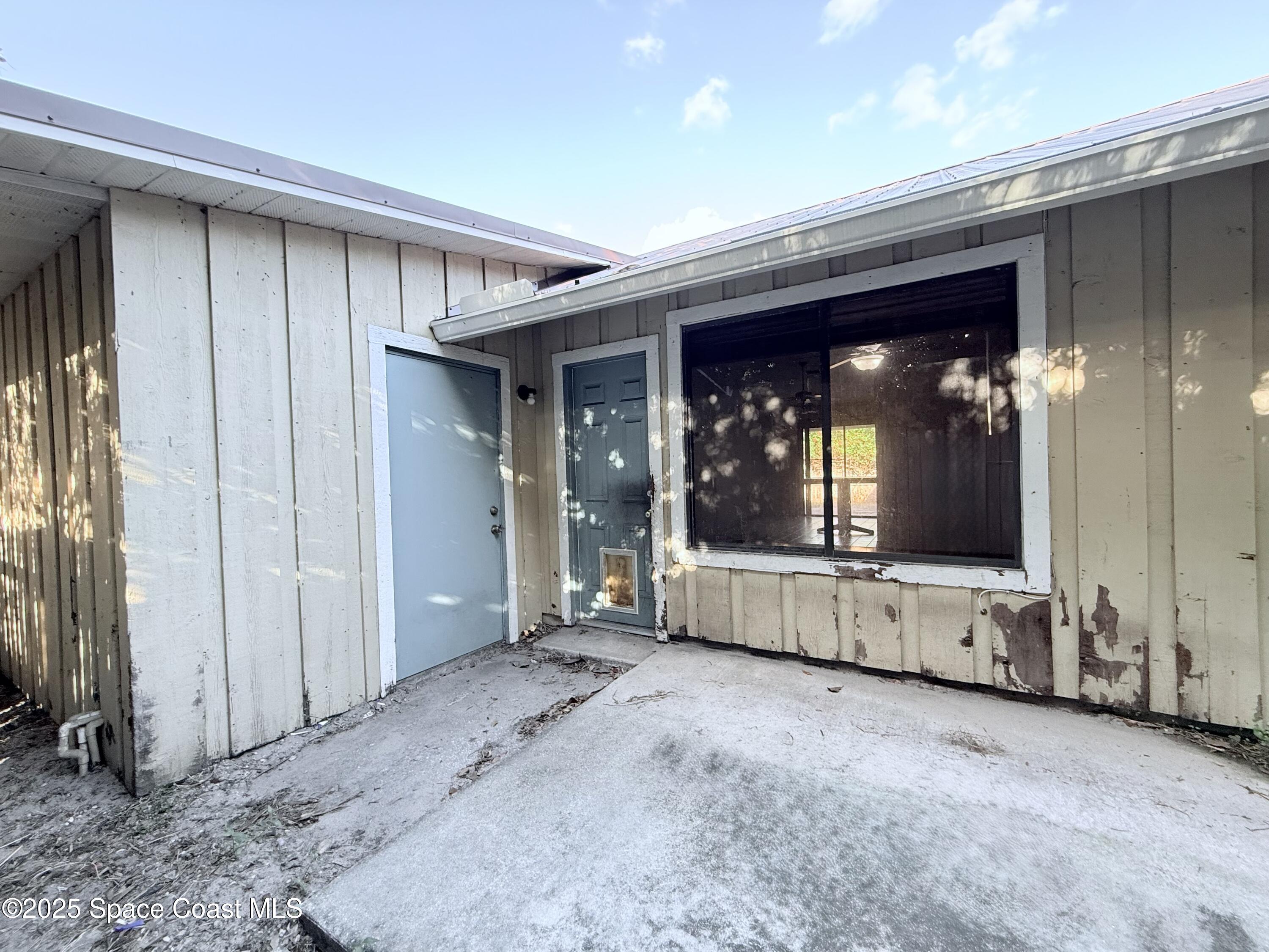 6180 Balboa Street Cocoa, FL 32927 - Photo 42 of 44 a view of a house with porch and wooden floor