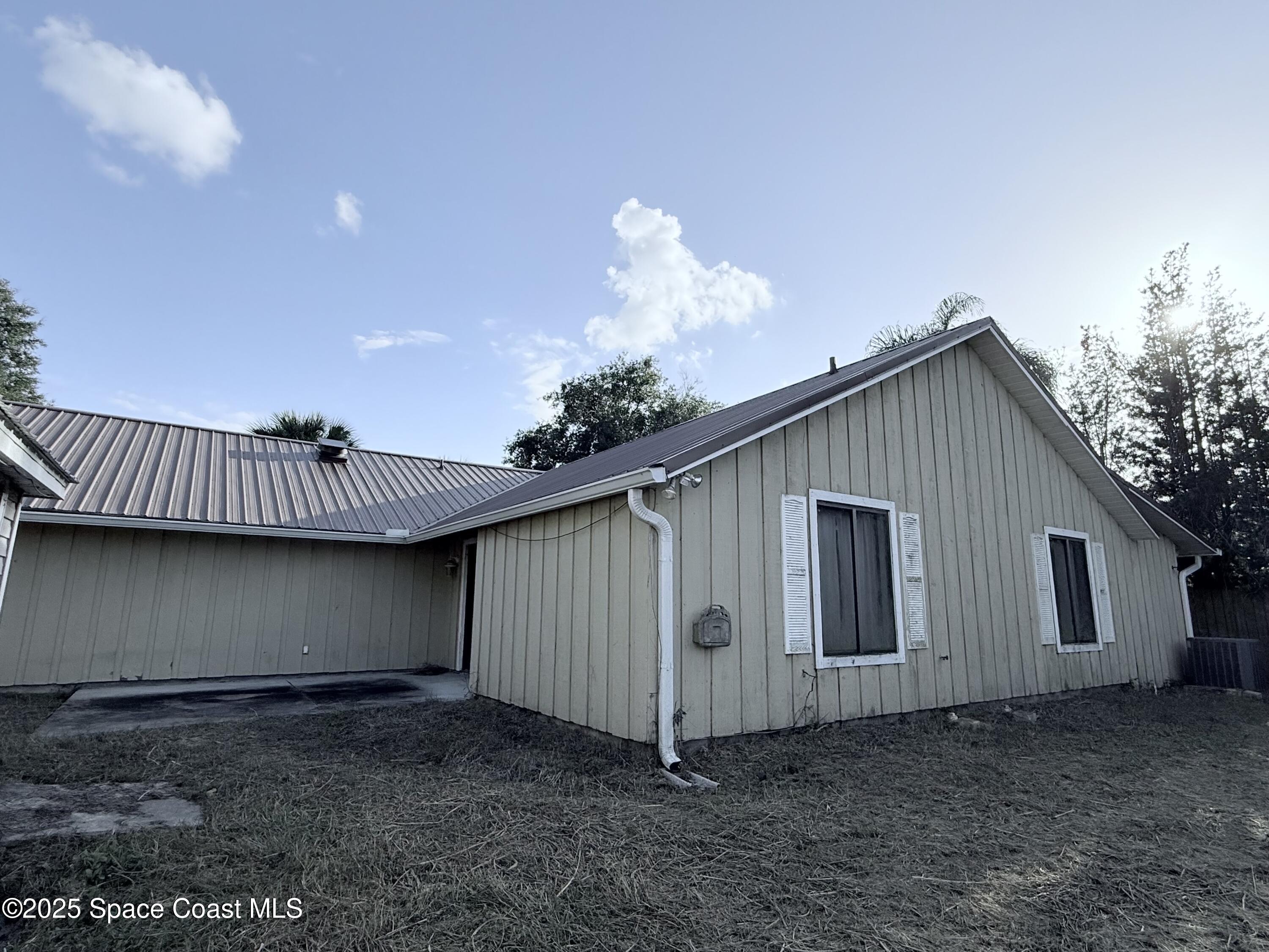 6180 Balboa Street Cocoa, FL 32927 - Photo 44 of 44 a view of a house with a yard