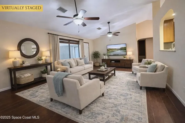 a living room with furniture and a large window