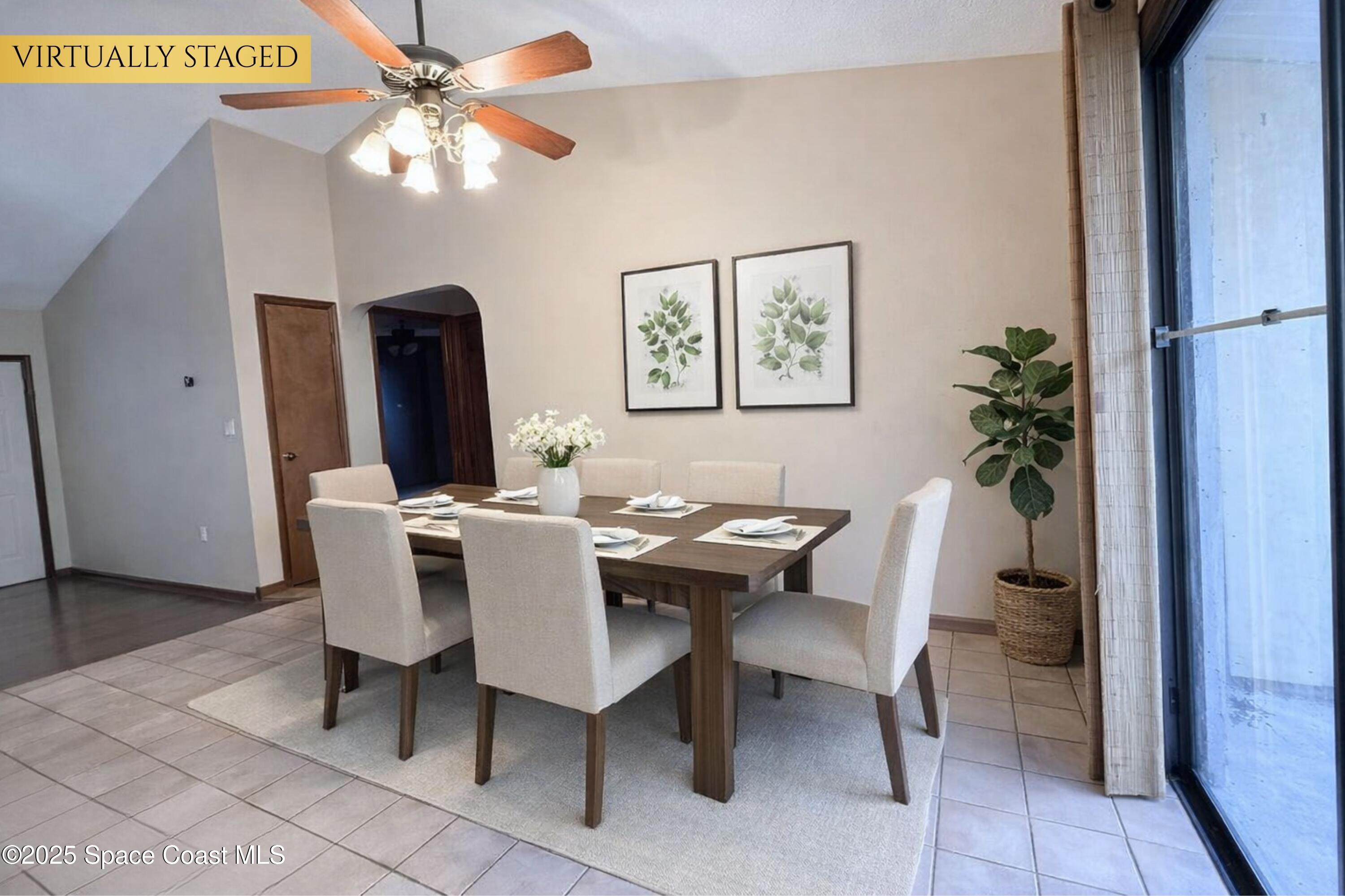 6180 Balboa Street Cocoa, FL 32927 - Photo 10 of 44 a view of a dining room with furniture and a chandelier fan