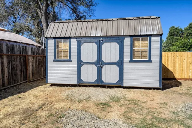 a front view of a house with wooden fence