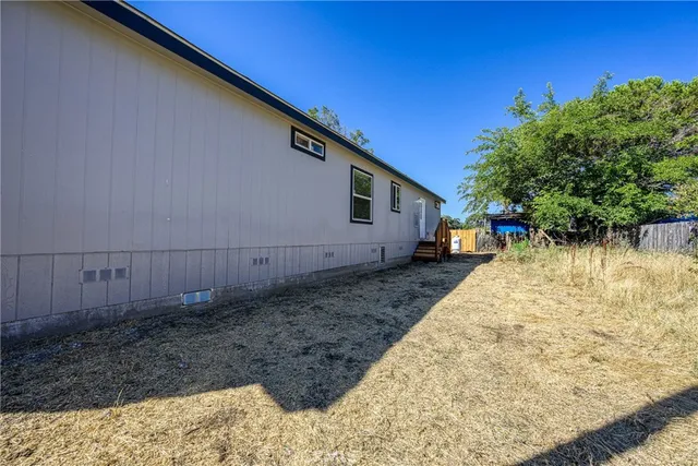 a backyard of a house with lots of green space