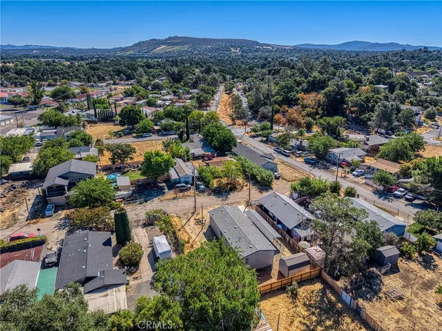 an aerial view of residential houses with outdoor space