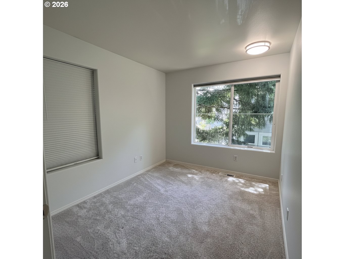 14110 Southwest Barrows Road, Unit 1 Portland, OR 97223 - Photo 14 of 18 a view of empty room with window