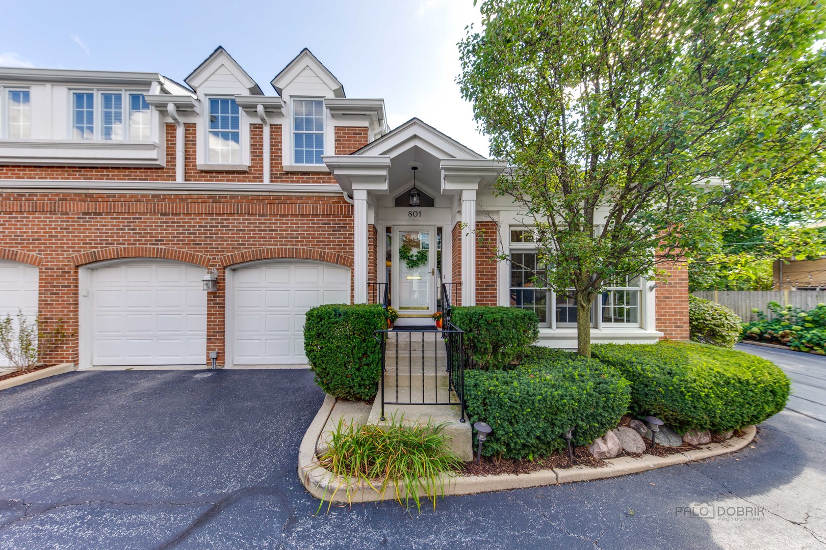 801 Hibbard Road Wilmette, IL 60091 - Photo 1 of 28 front view of a house with a garden