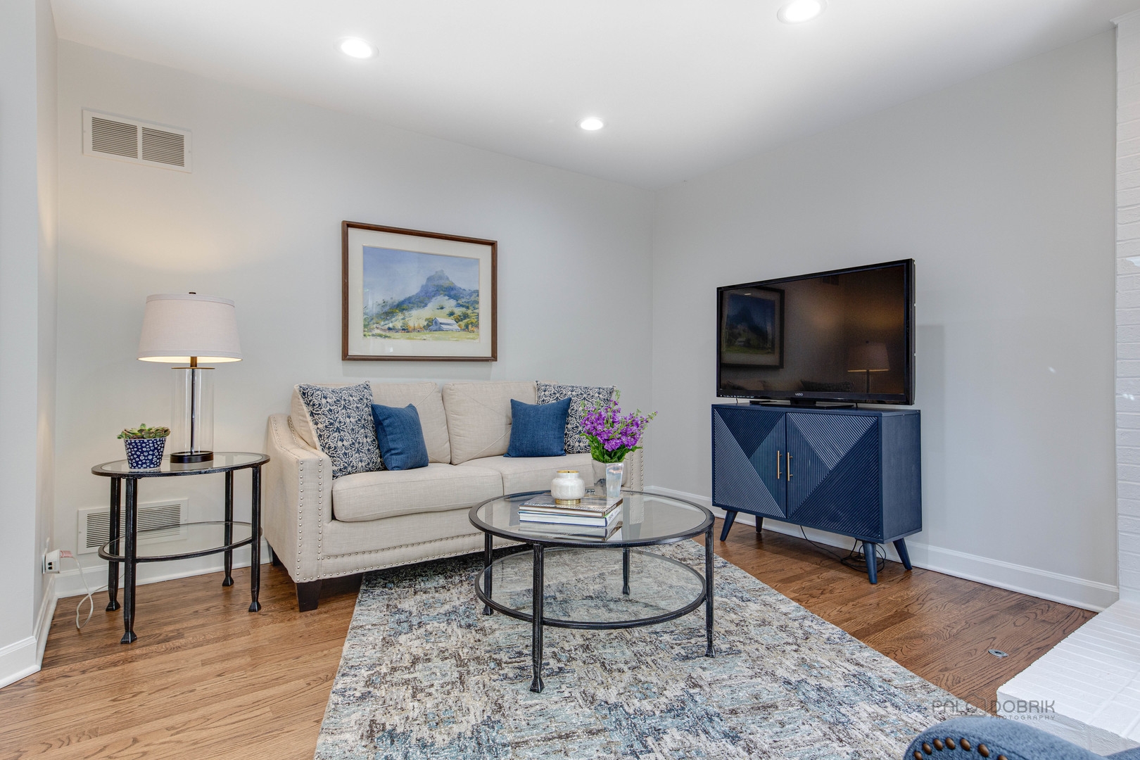 801 Hibbard Road Wilmette, IL 60091 - Photo 12 of 28 a living room with furniture and a flat screen tv