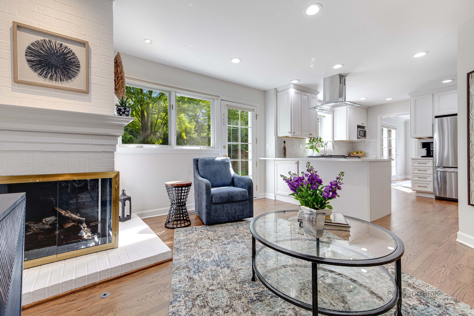 801 Hibbard Road Wilmette, IL 60091 - Photo 13 of 28 a living room with furniture and a fireplace