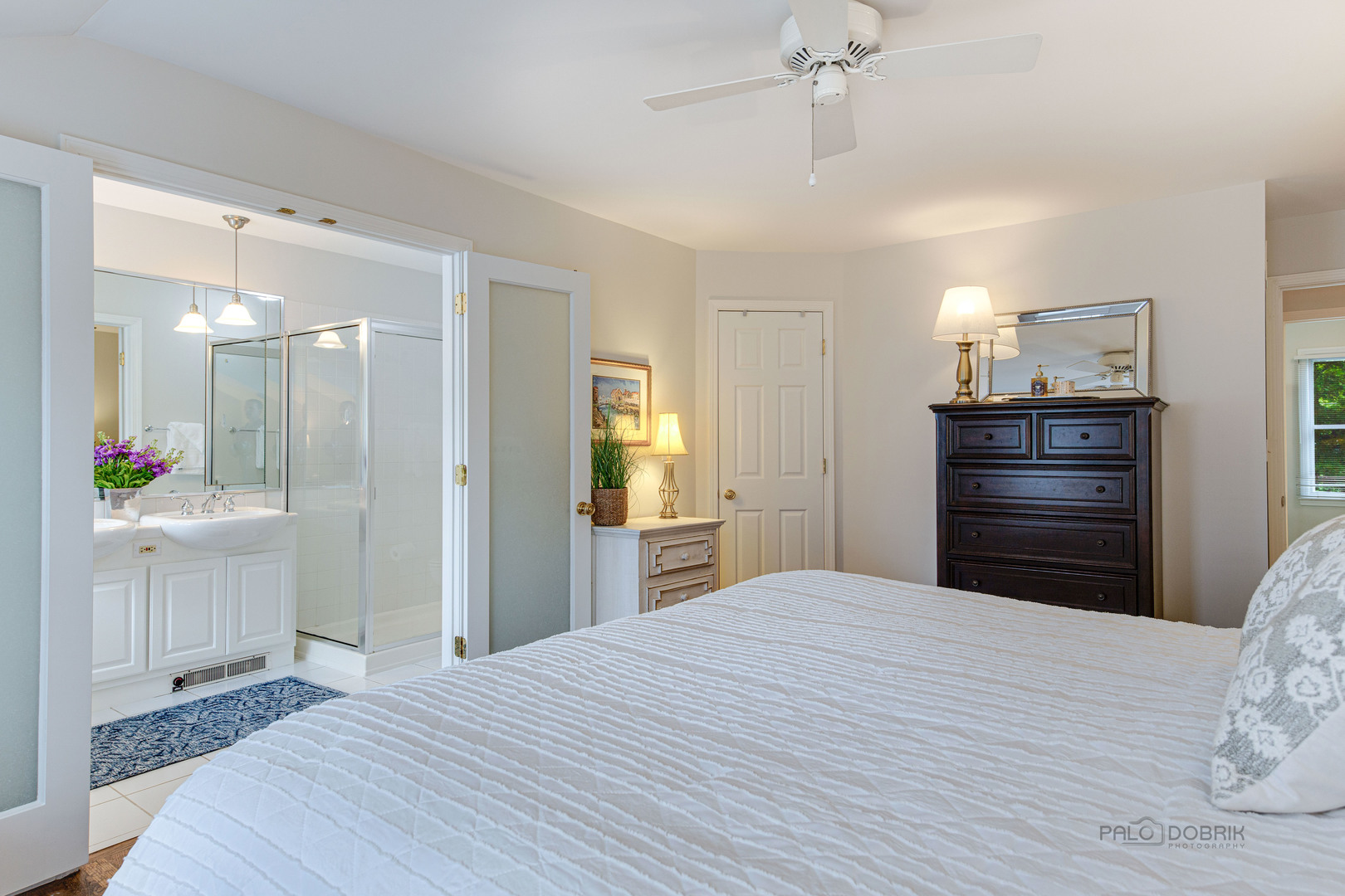 801 Hibbard Road Wilmette, IL 60091 - Photo 18 of 28 a bedroom with a bed and a dresser