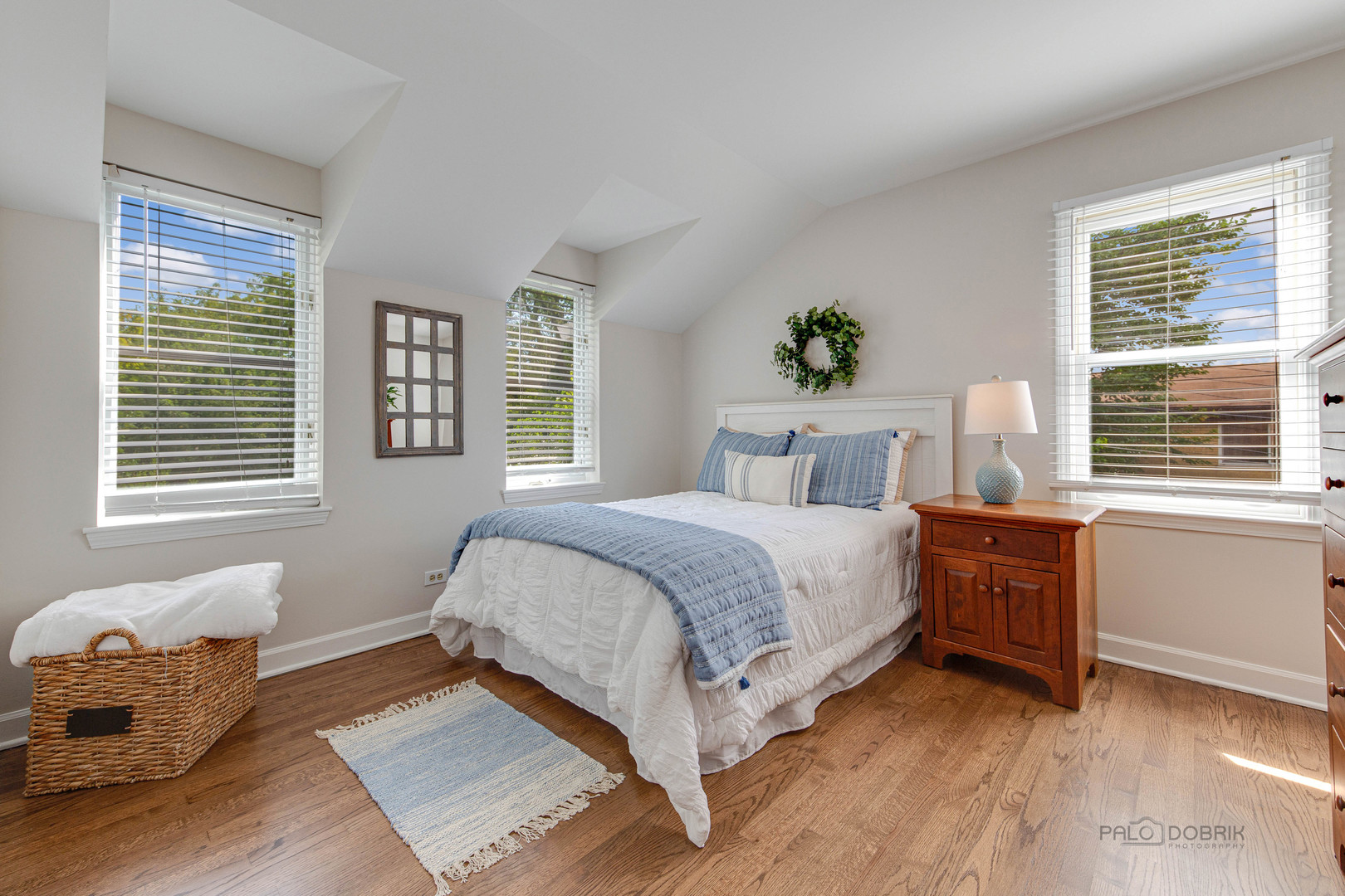 801 Hibbard Road Wilmette, IL 60091 - Photo 23 of 28 a bedroom with a bed and window