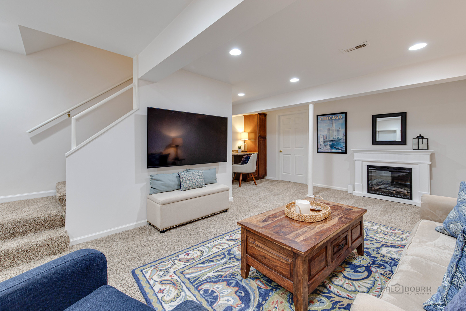 801 Hibbard Road Wilmette, IL 60091 - Photo 25 of 28 a living room with furniture and a flat screen tv