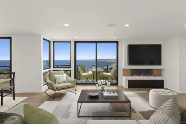 an empty room with floor to ceiling window and an outdoor view