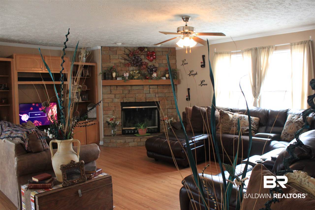 9380 Spice Pond Road Eight Mile, AL 36613 - Photo 17 of 36 16x21 w/laminate flooring & built-in cabinetry.