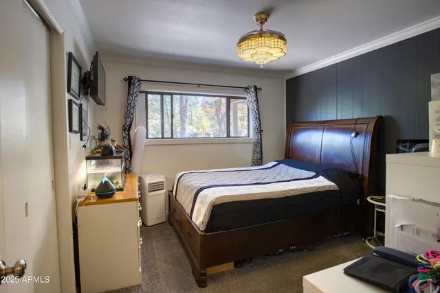 a bedroom with a bed and a lamp