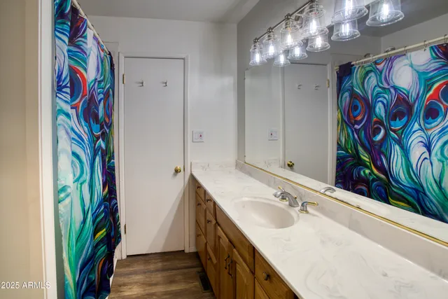 a bathroom with a sink and a mirror