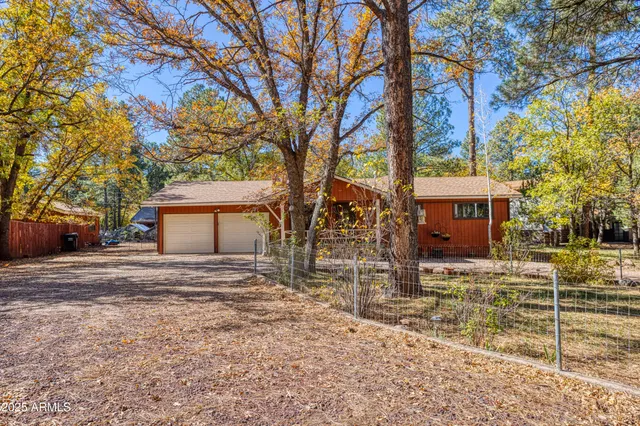 a view of a house with a yard covered in snow