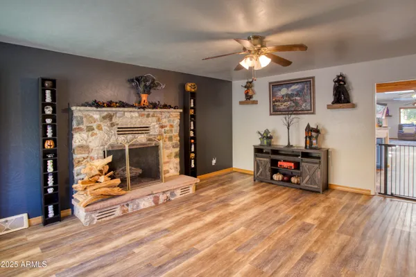 a view of a livingroom with furniture and a flat screen tv