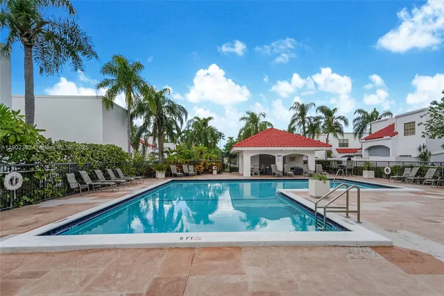 a view of swimming pool with outdoor seating