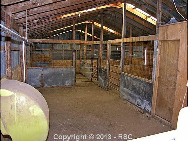 8265 North Log Road Peyton, CO 80831 - Photo 15 of 20 Barn and Stalls