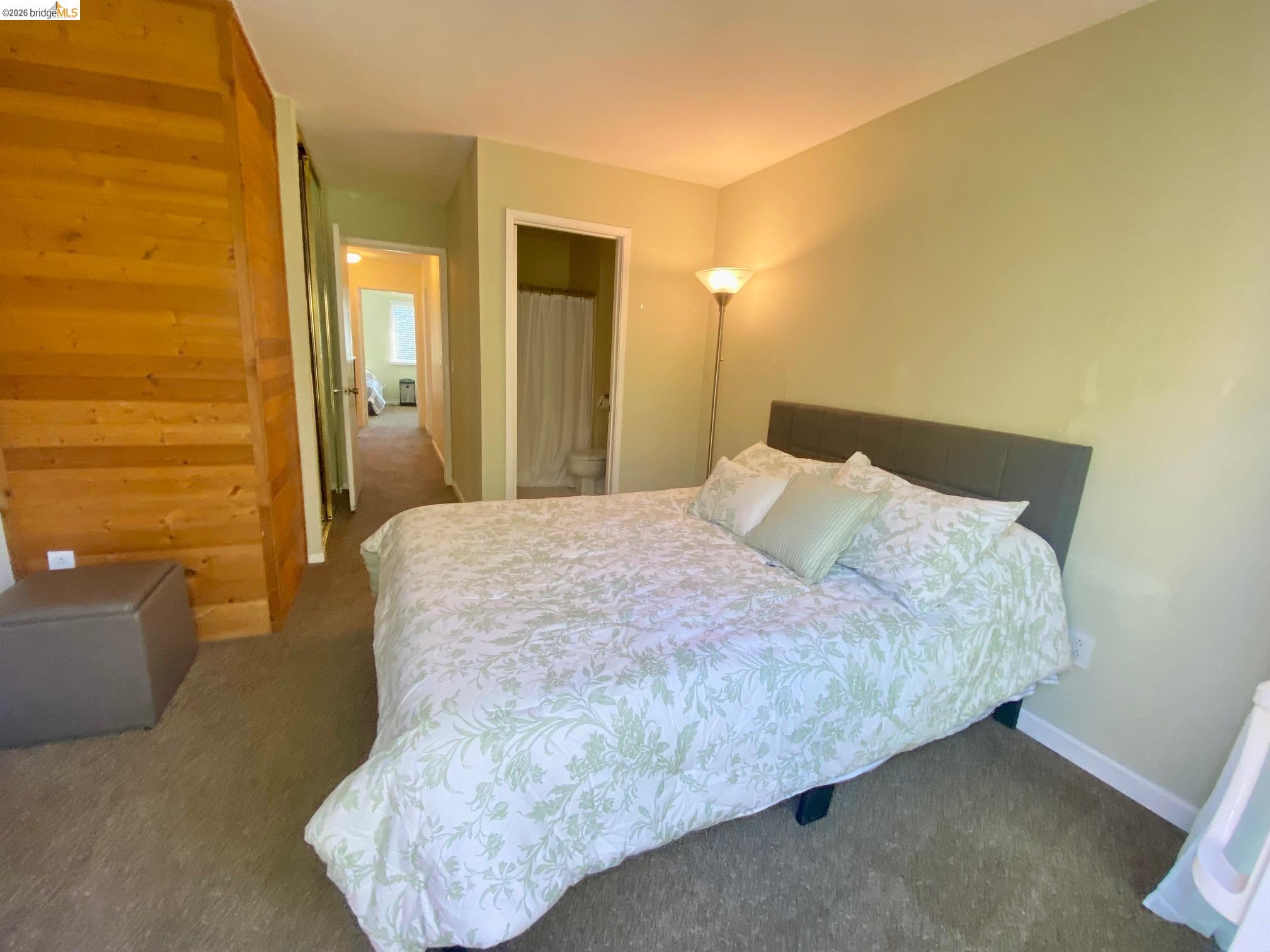19096 Dyer Court, Unit 2 Groveland, CA 95321 - Photo 17 of 46 a bedroom with a bed and couch