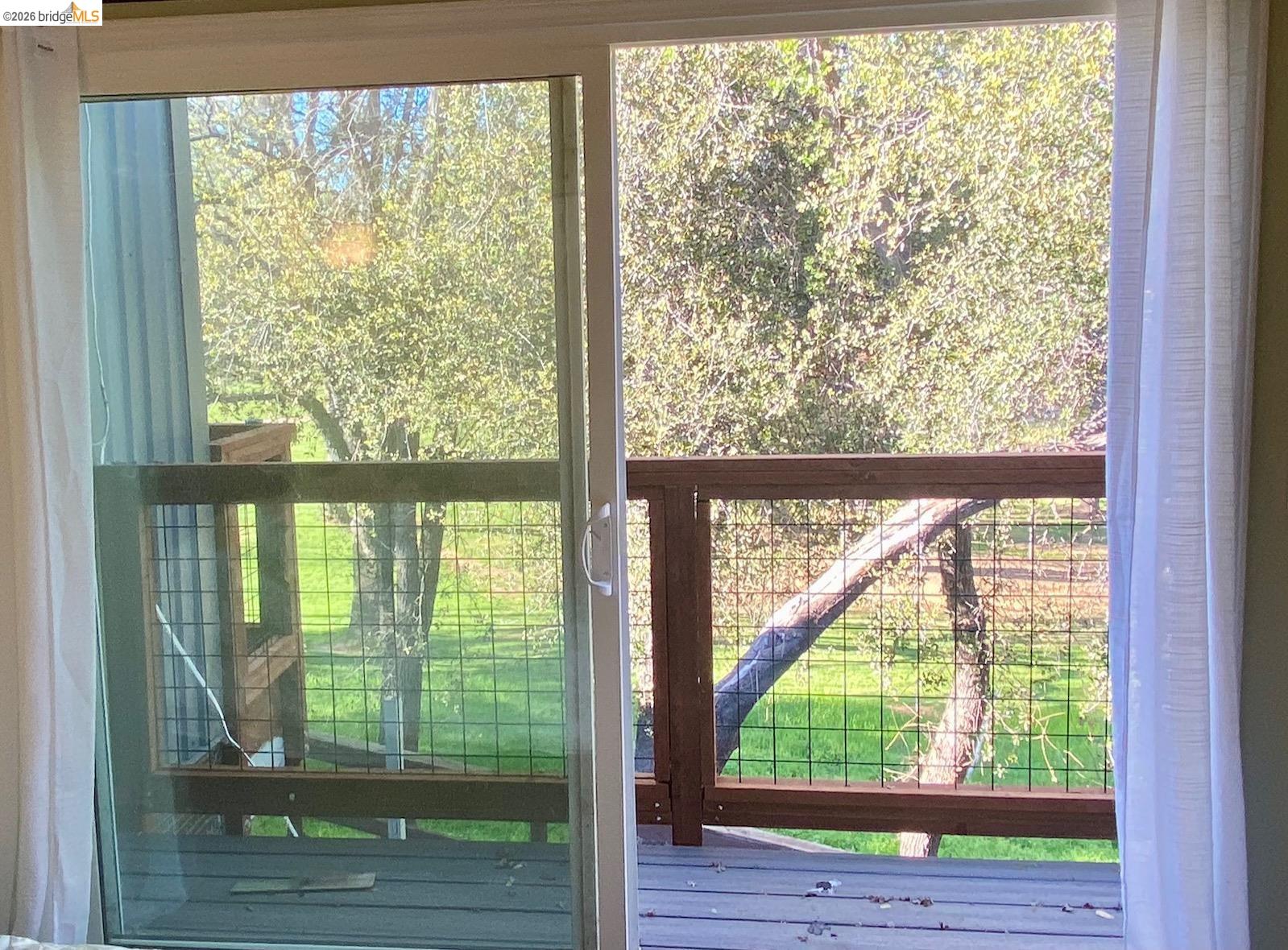 19096 Dyer Court, Unit 2 Groveland, CA 95321 - Photo 19 of 46 a view of a room with wooden floor and a window