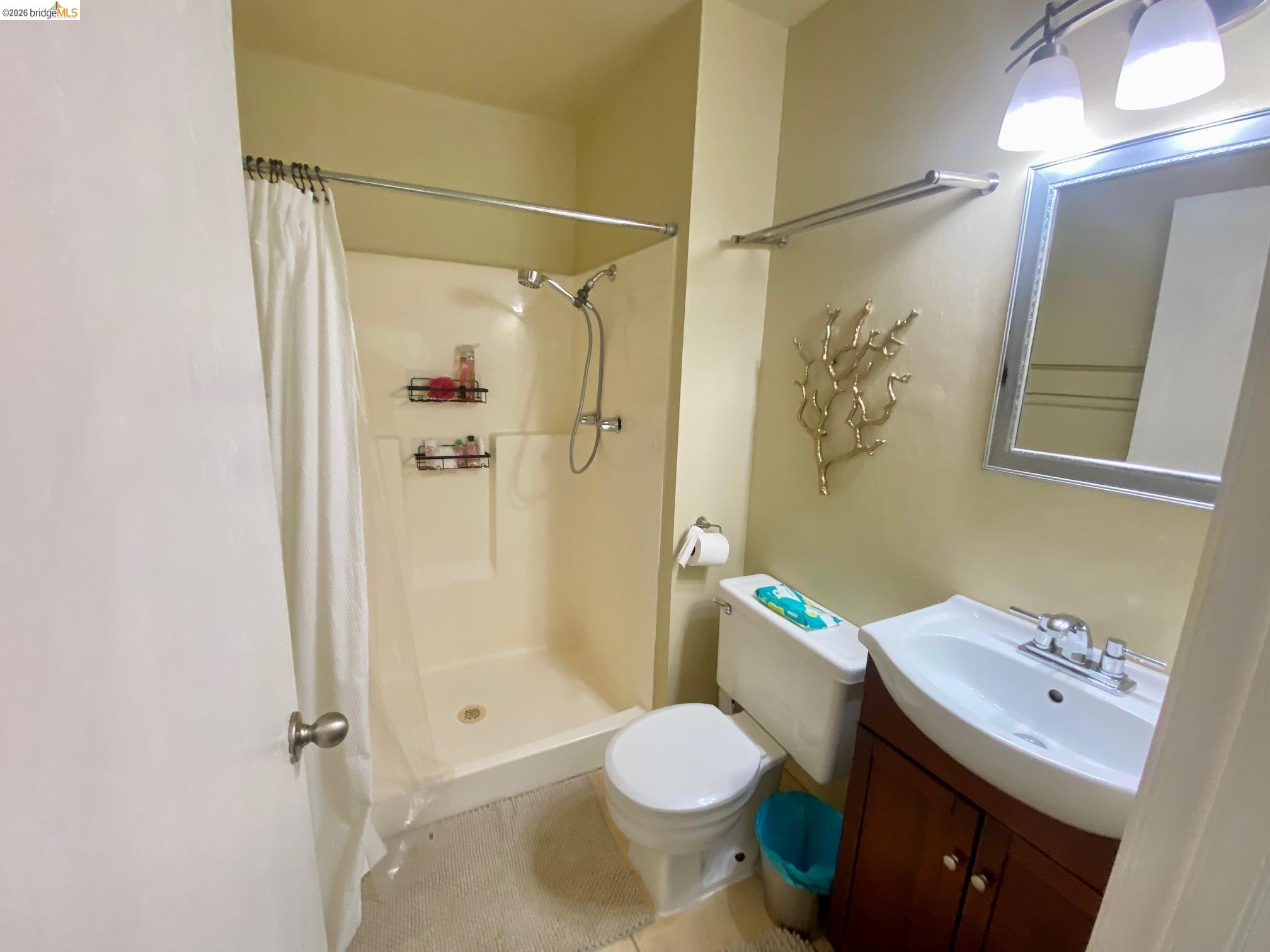 19096 Dyer Court, Unit 2 Groveland, CA 95321 - Photo 22 of 46 a bathroom with a sink toilet and shower