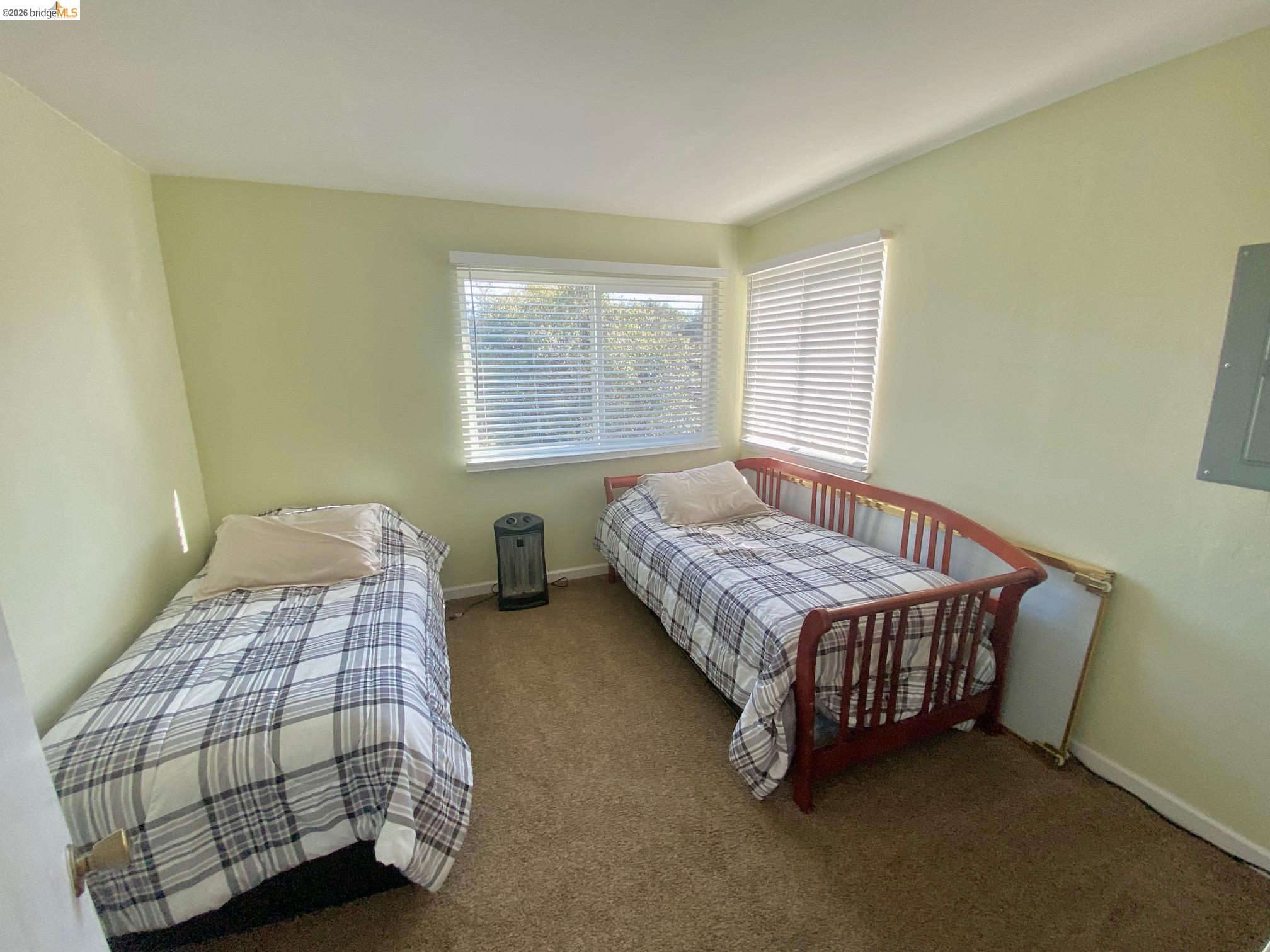 19096 Dyer Court, Unit 2 Groveland, CA 95321 - Photo 26 of 46 a bedroom with a bed window and a night stand in it