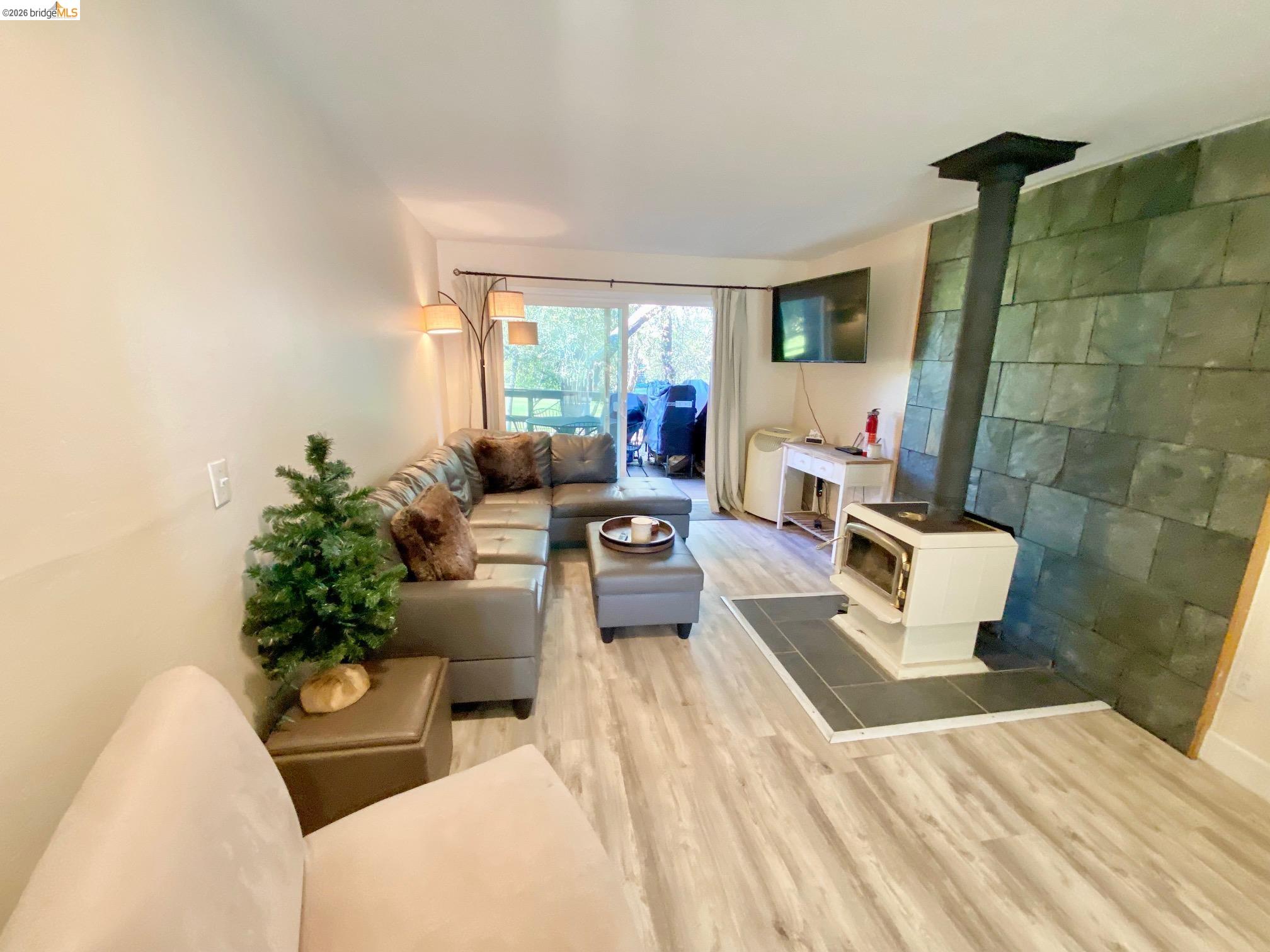 19096 Dyer Court, Unit 2 Groveland, CA 95321 - Photo 8 of 46 a living room with furniture and a fireplace