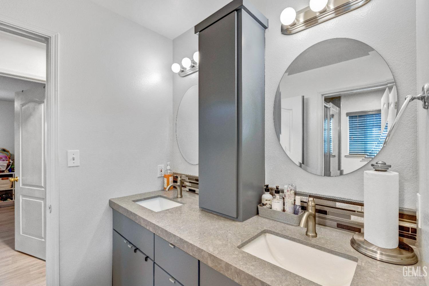 Undisclosed Address Delano, CA 93215 - Photo 24 of 40 a bathroom with a sink vanity and a mirror
