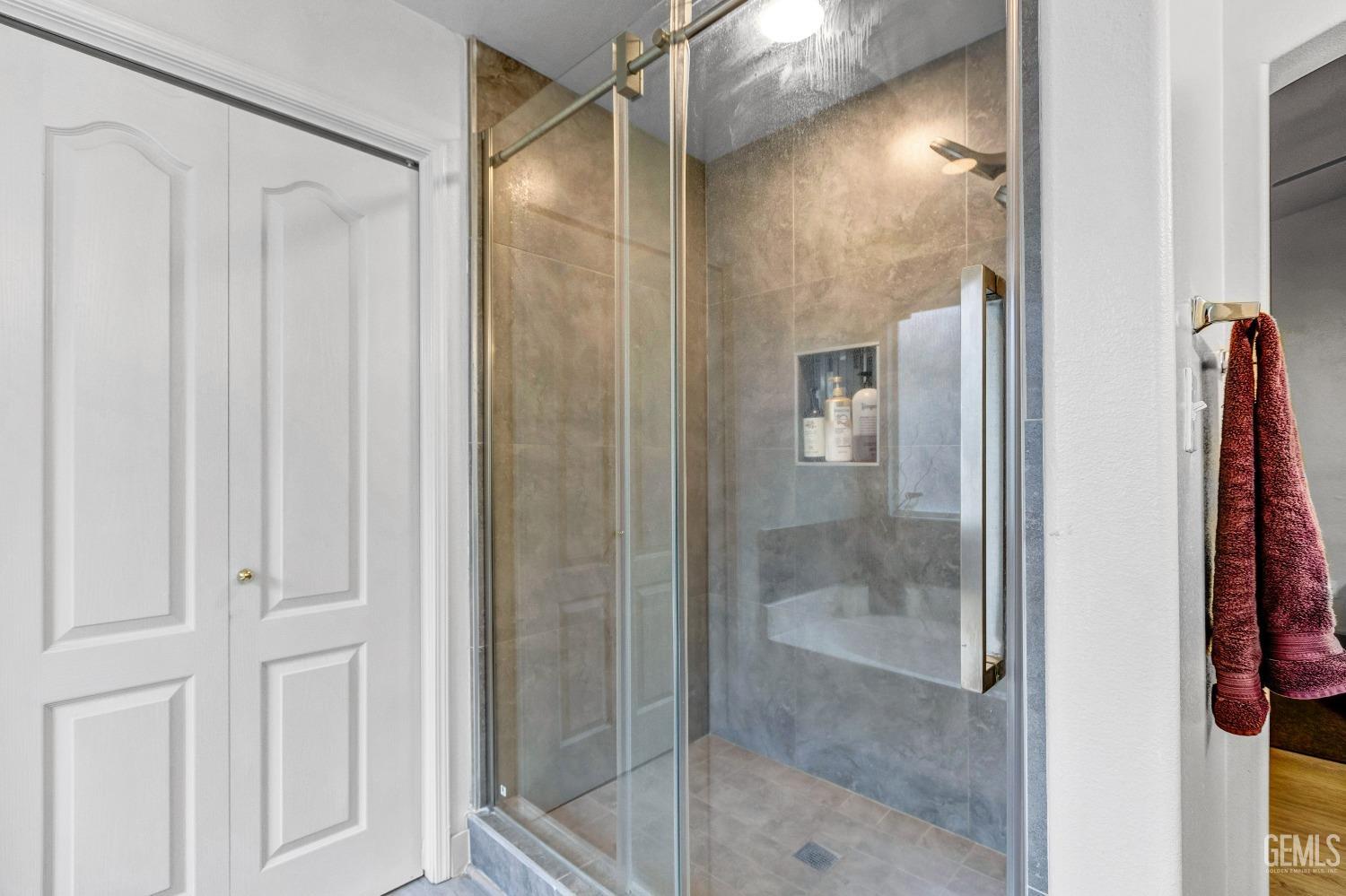 Undisclosed Address Delano, CA 93215 - Photo 37 of 40 a bathroom with a glass shower door