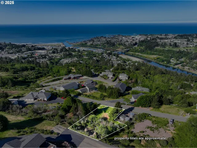 an aerial view of a city and mountain view in back