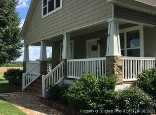 a view of a house with a small yard