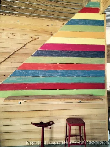 a room with a bench and cabinets