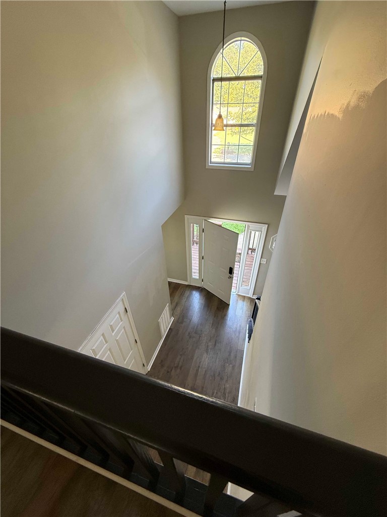 116 Kelly Lane Easley, SC 29642 - Photo 34 of 39 An arched window floods the two-story entryway and wood flooring with natural light.