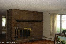 4536 Atkins Road North Street, MI 48049 - Photo 7 of 9 LIVING ROOM FIREPLACE