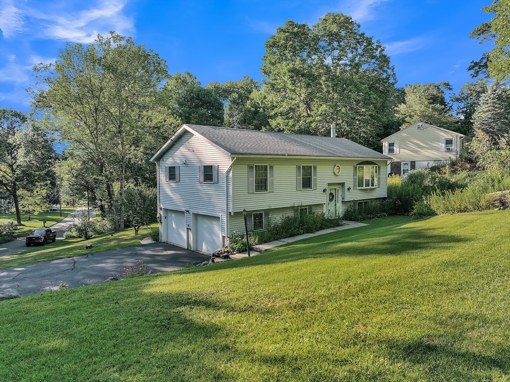 4 Crest Road Monson, MA 01057 - Photo 1 of 34 a view of a house with a big yard and large trees
