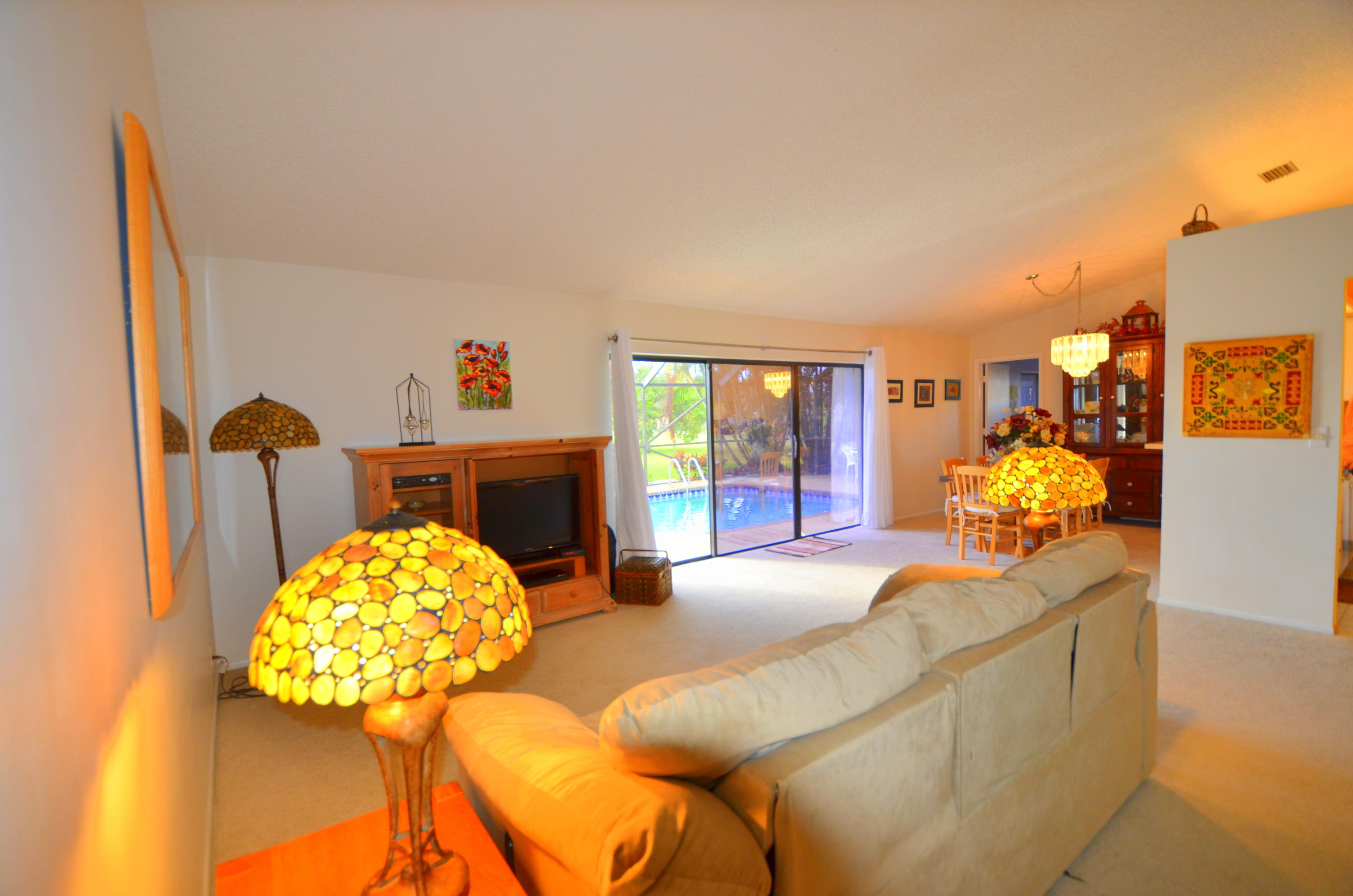 9539 Silverspring Lane Boca Raton, FL 33434 - Photo 11 of 28 a living room with furniture and a fireplace