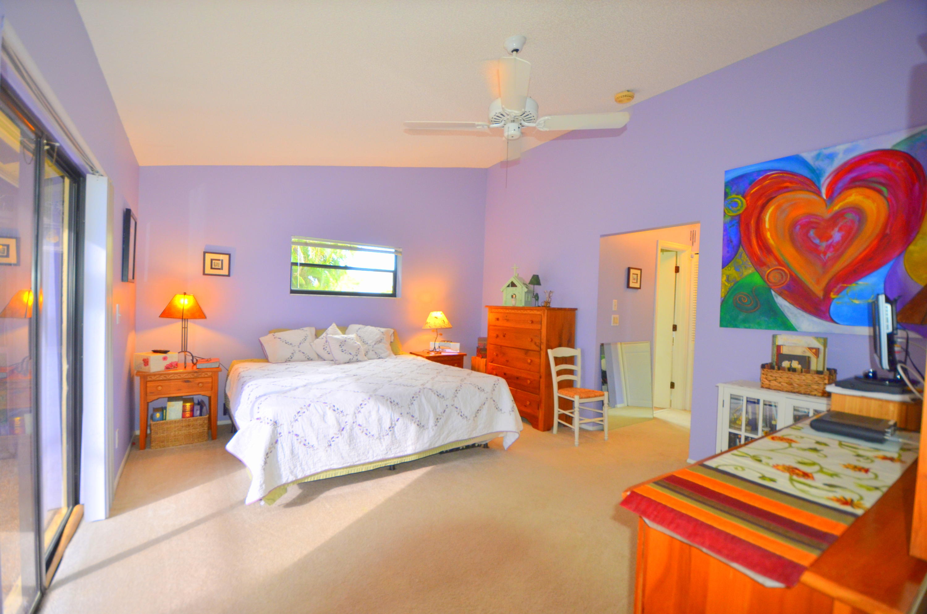 9539 Silverspring Lane Boca Raton, FL 33434 - Photo 15 of 28 a bedroom with a bed and dresser