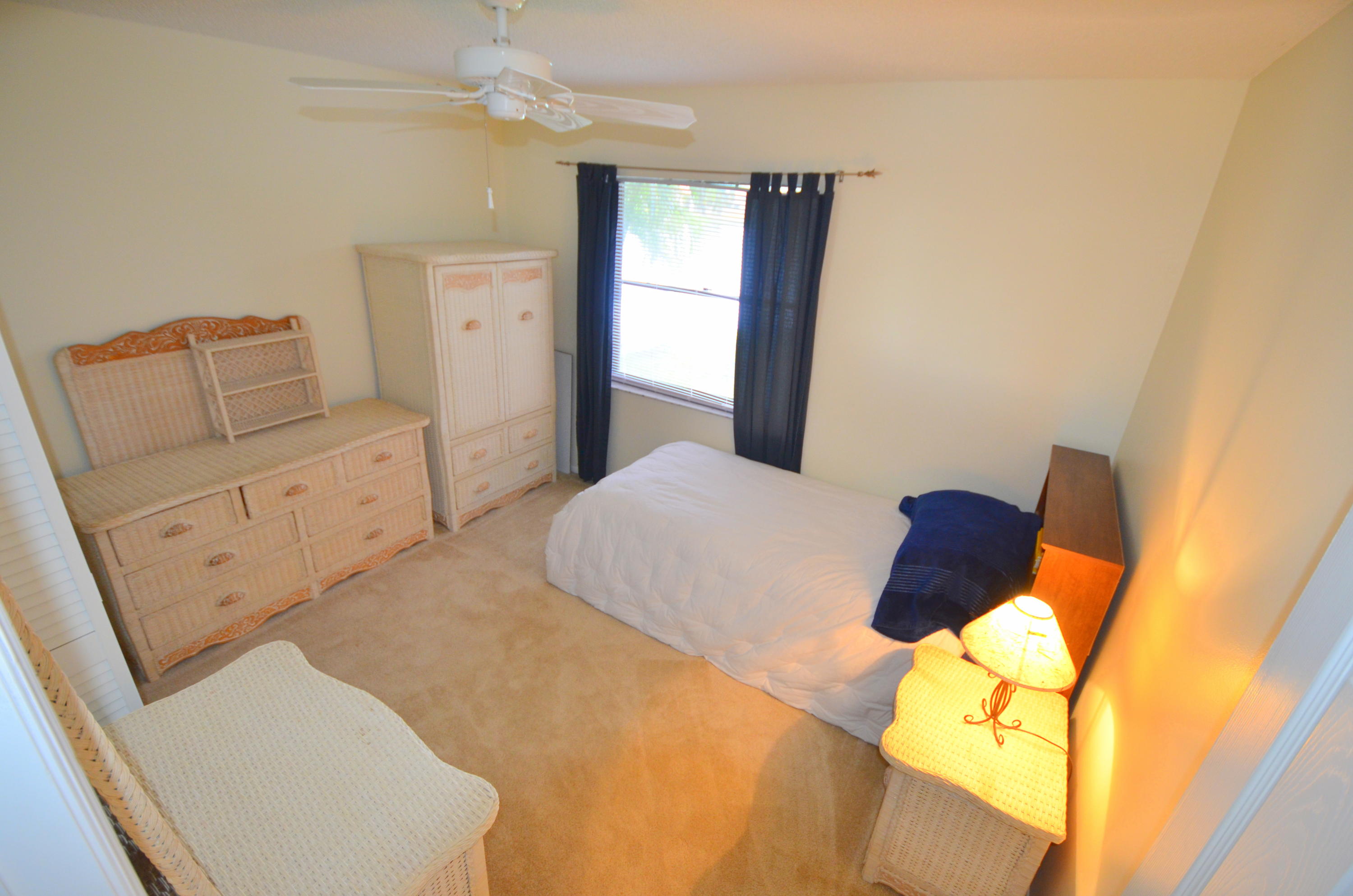 9539 Silverspring Lane Boca Raton, FL 33434 - Photo 18 of 28 a bedroom with a bed and a couch