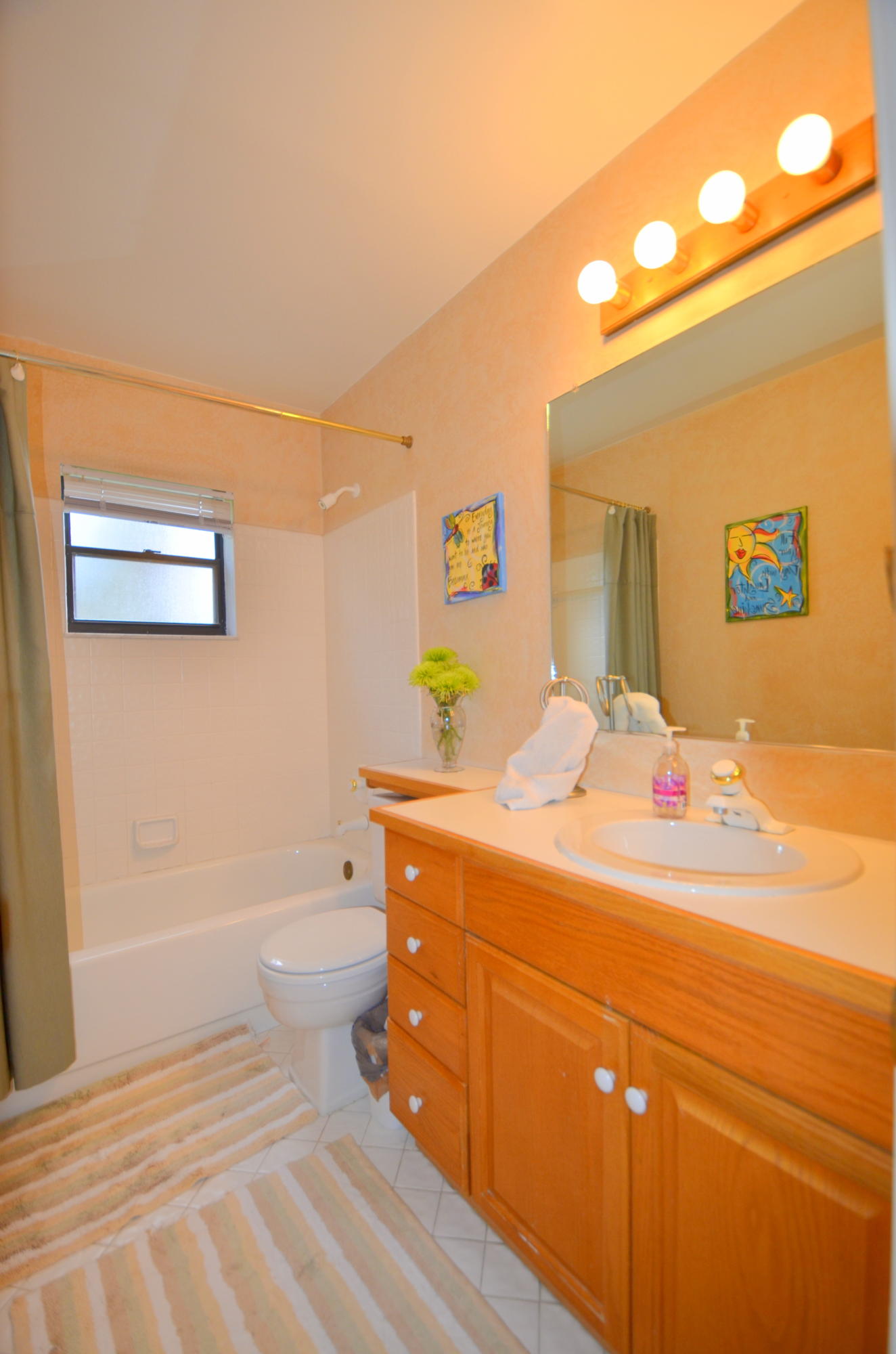 9539 Silverspring Lane Boca Raton, FL 33434 - Photo 19 of 28 a bathroom with a sink a toilet and shower