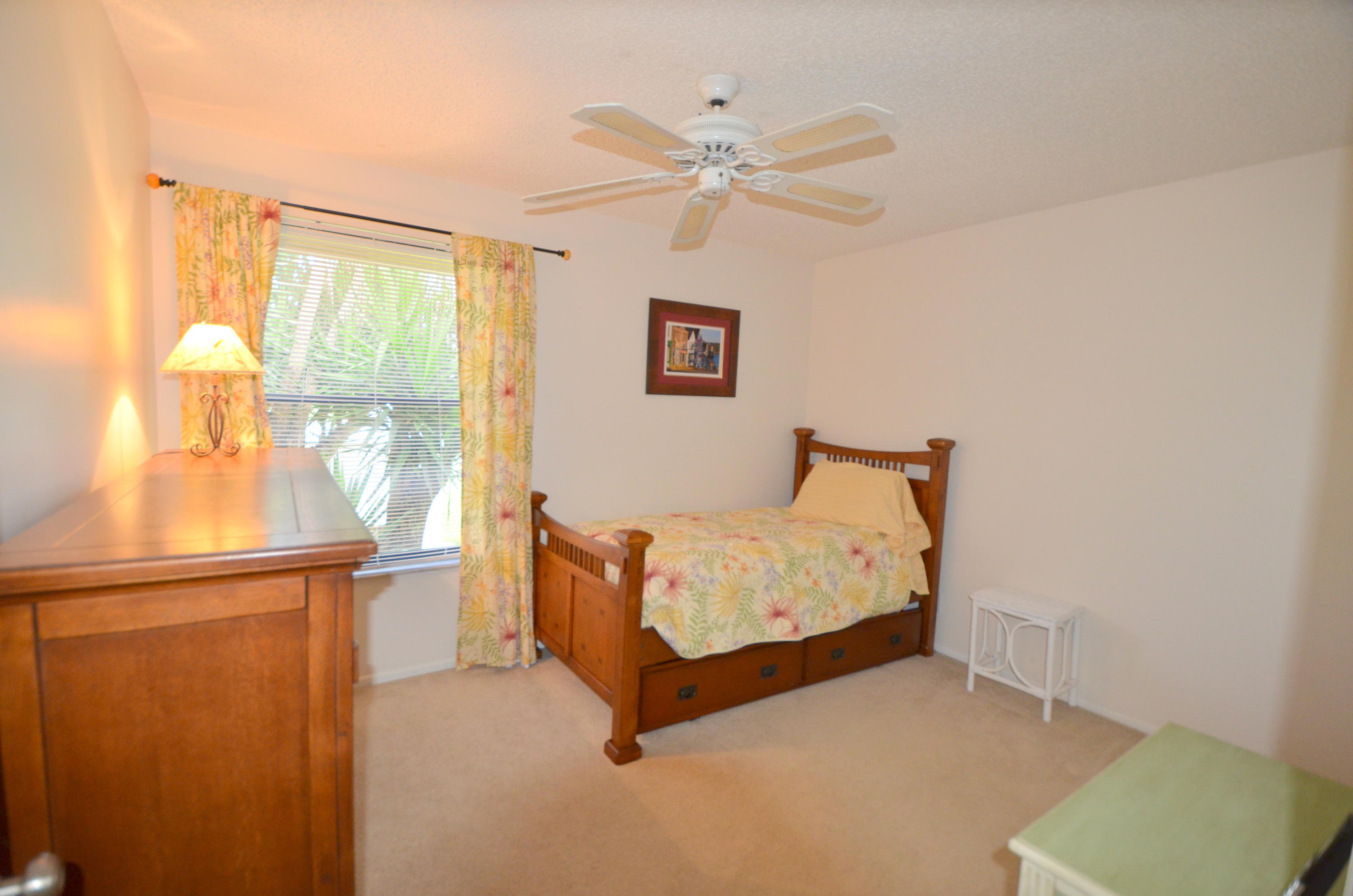 9539 Silverspring Lane Boca Raton, FL 33434 - Photo 20 of 28 a bed room with a bed and a window