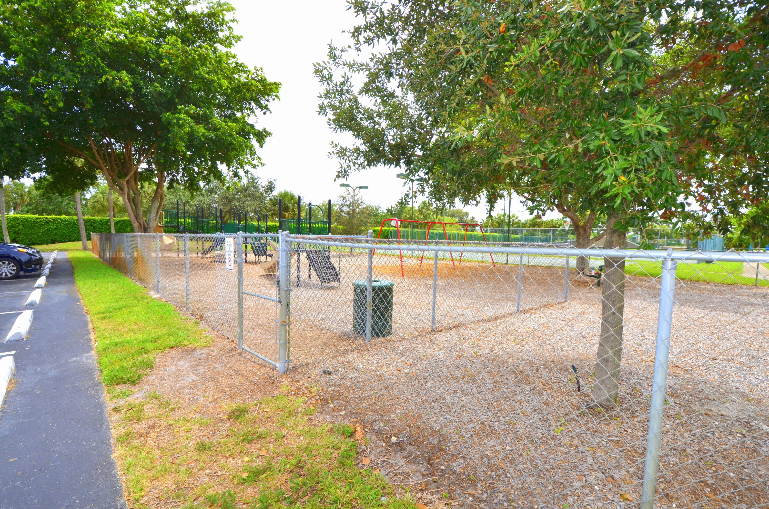 9539 Silverspring Lane Boca Raton, FL 33434 - Photo 24 of 28 a view of a swimming pool with a patio