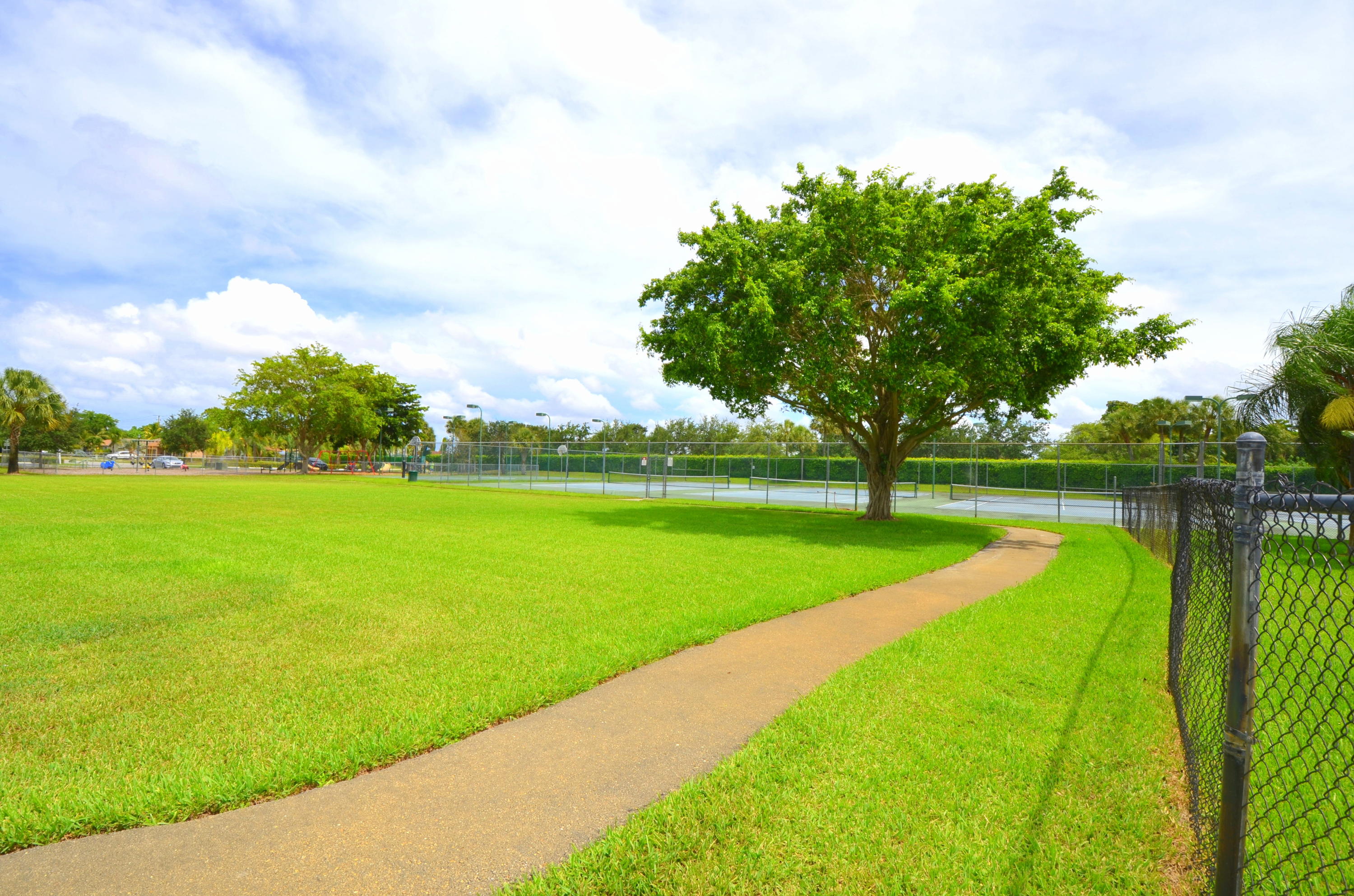 9539 Silverspring Lane Boca Raton, FL 33434 - Photo 26 of 28 a view of a lake with a yard