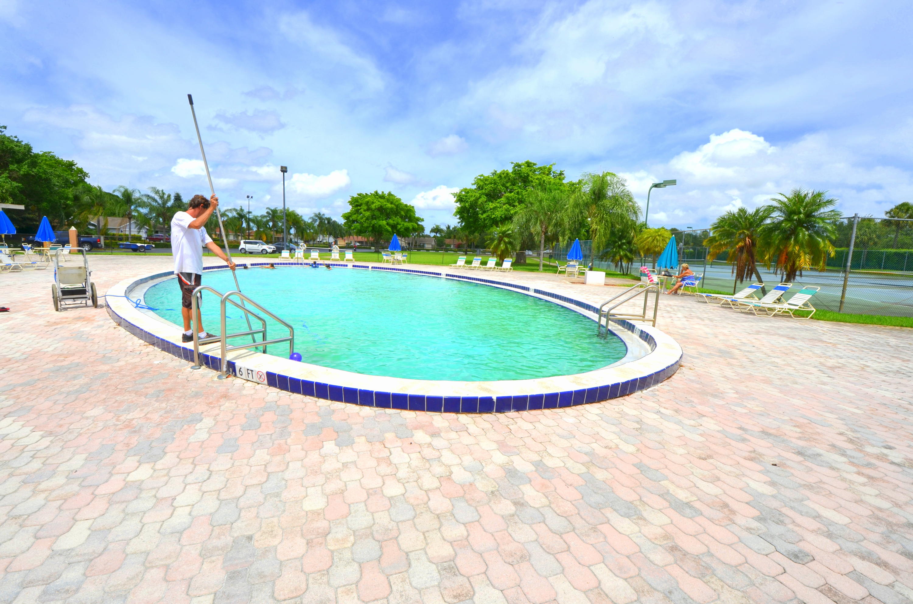 9539 Silverspring Lane Boca Raton, FL 33434 - Photo 28 of 28 a view of a swimming pool with a yard
