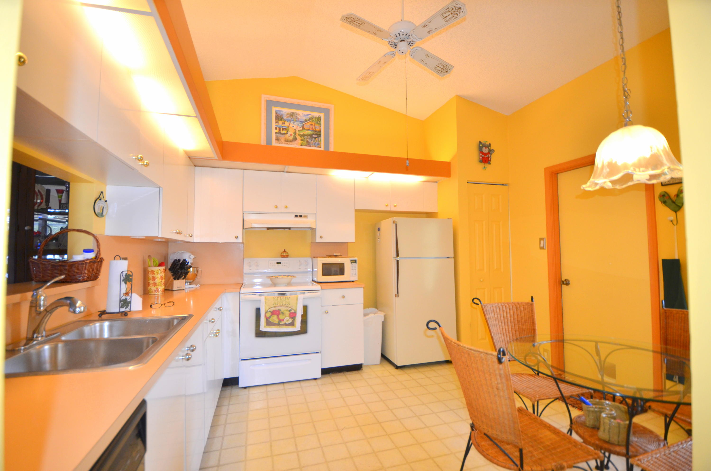 9539 Silverspring Lane Boca Raton, FL 33434 - Photo 6 of 28 a view of a kitchen with furniture and a kitchen view