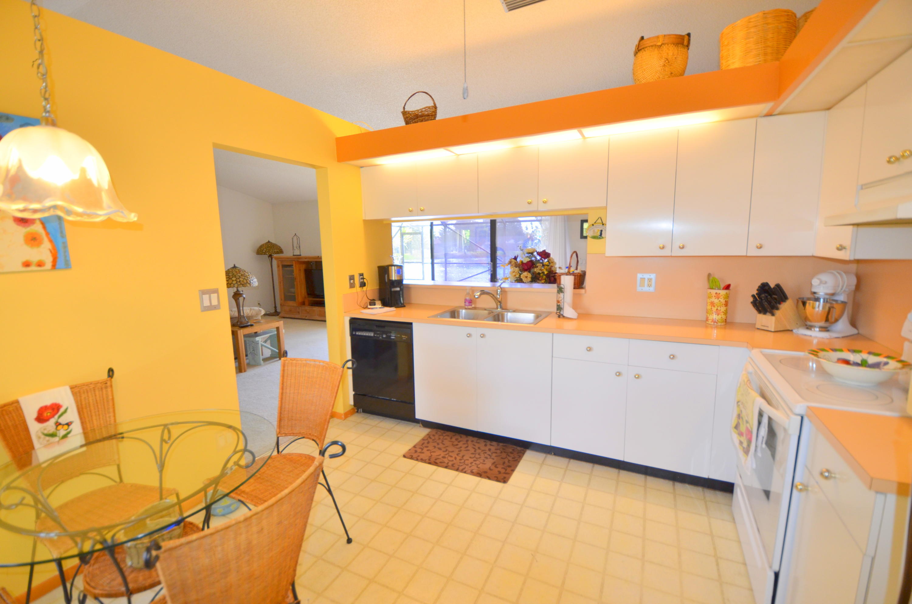 9539 Silverspring Lane Boca Raton, FL 33434 - Photo 7 of 28 a view of a kitchen with a sink cabinets and a window