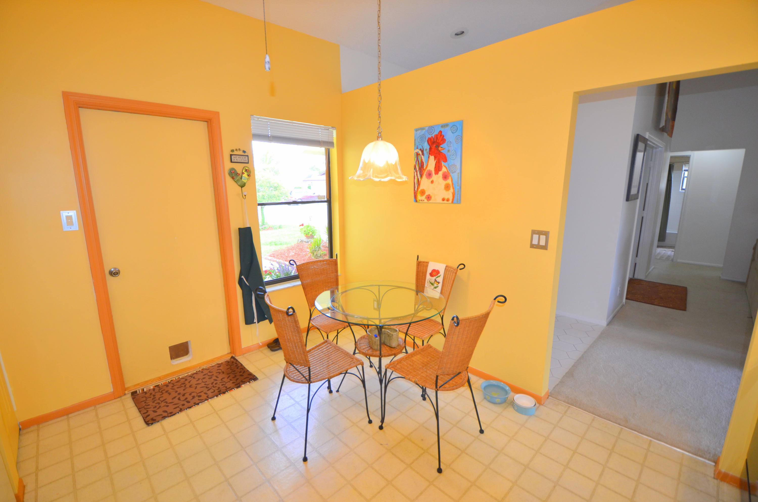 9539 Silverspring Lane Boca Raton, FL 33434 - Photo 9 of 28 a view of an empty room with a glass door