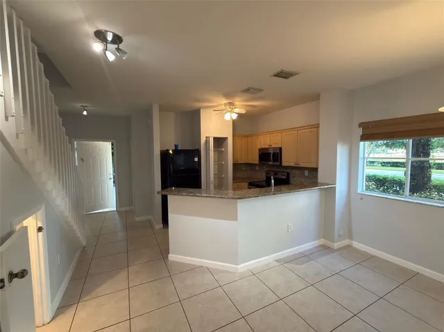 a view of living room with furniture and a window