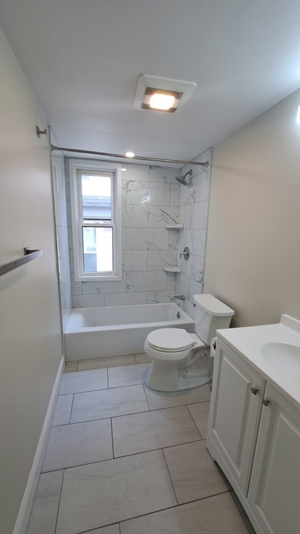 7 Samoset Street, Unit 2 Boston, MA 02124 - Photo 4 of 12 a bathroom with a sink a toilet and shower