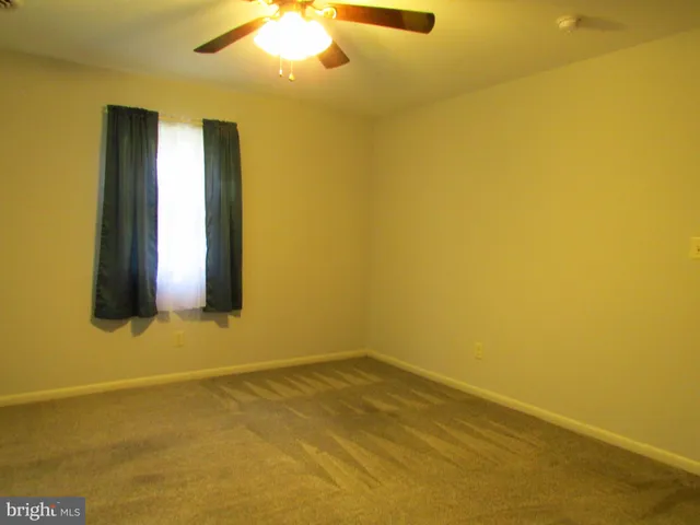 a view of an empty room with window