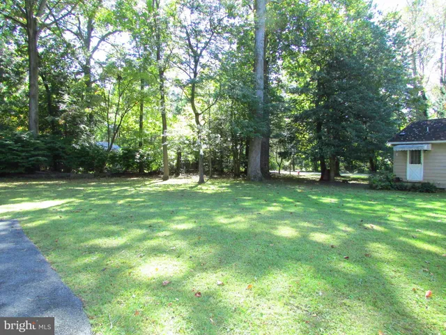 a view of outdoor space with deck and yard